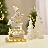 Figurine de Noël Enfant sur renne Pastel